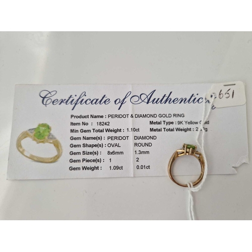 651 - A peridot and diamond ring 9ct size O 3.1 gms