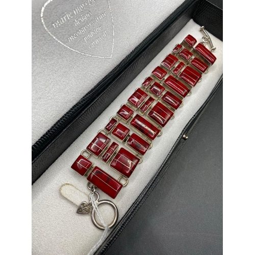 68 - A heavy Marie Morrison silver red stone wide abstract bracelet (with original purchase receipt) 107g