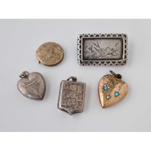 701 - A bag of four lockets and a brooch