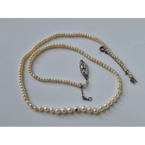 737 - Antique string of graduated natural pearls on a diamond set clasp with a certificate from Stephen Ke... 