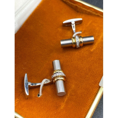 743 - A PAIR OF DIAMOND TWO COLOUR DRESS CUFFLINKS 18CT GOLD THE SOLID TUBE DESIGN ENCIRCLED BY DIAMONDS B... 