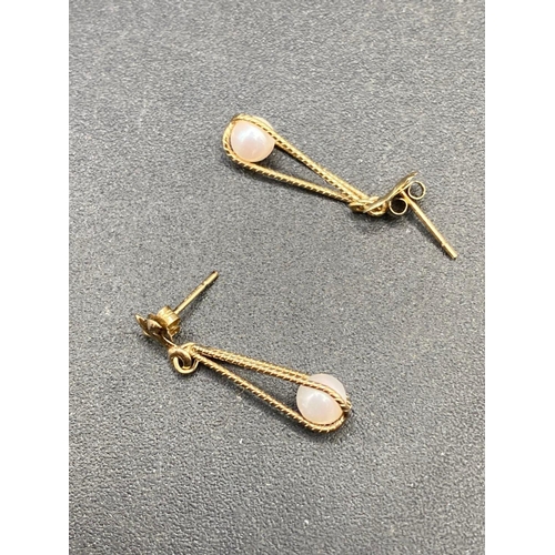 748 - A Pair of Gold Drop Earrings with Fleur de lis detail