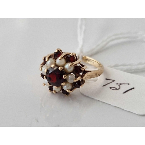 751 - A pearl and garnet ring 9ct size H 2.4 gms