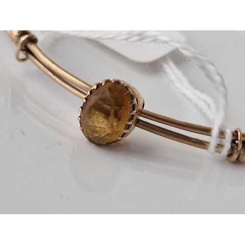 784 - A gold expanding stone set bangle 4.4 gms 60mm diameter