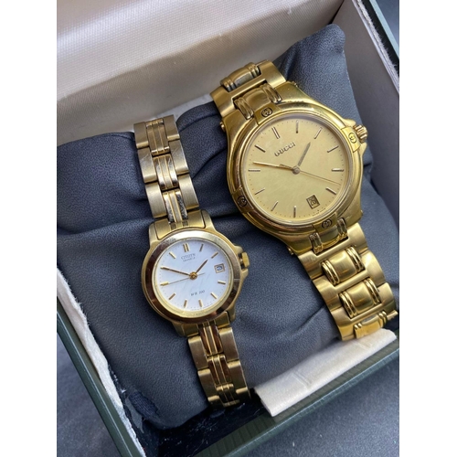 819 - A gents and ladies GUCCI wrist watches in box