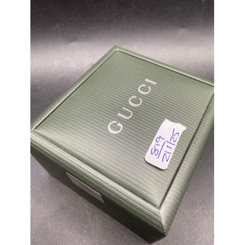 819 - A gents and ladies GUCCI wrist watches in box