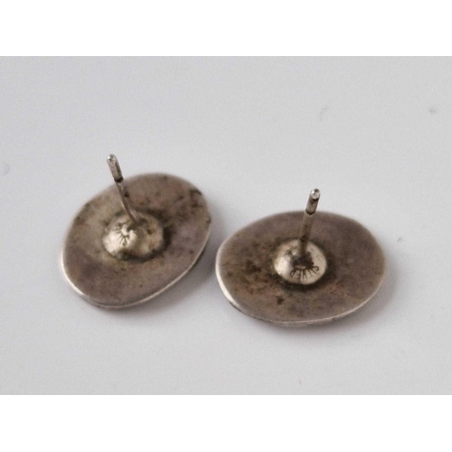 86 - A pair of silver IONA style ear studs