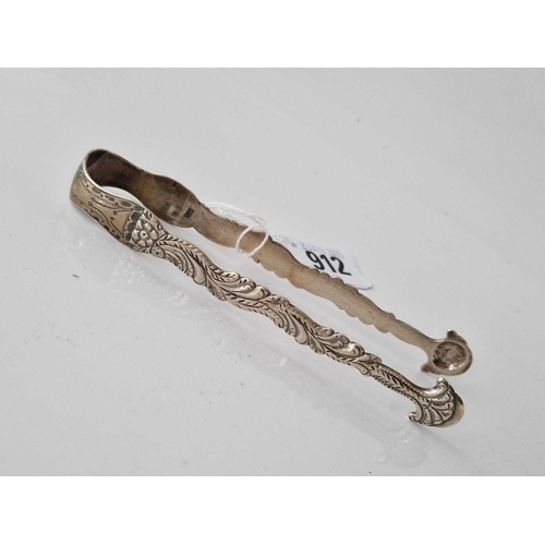 912 - A pair of George III sugar tongs with cast decoration by script JE, 36g