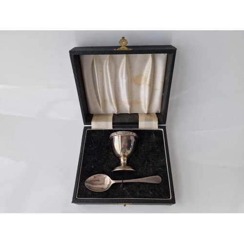 928 - Boxed egg cup and spoon with Celtic style rim. Birmingham 1958. 46gms