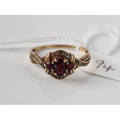 94 - A three stone garnet ring 9ct size V 2.4 gms