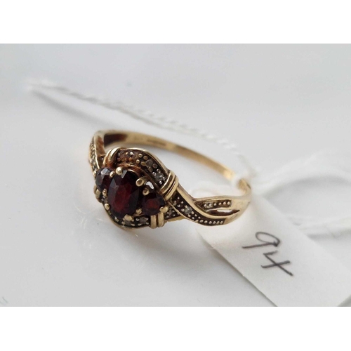 94 - A three stone garnet ring 9ct size V 2.4 gms