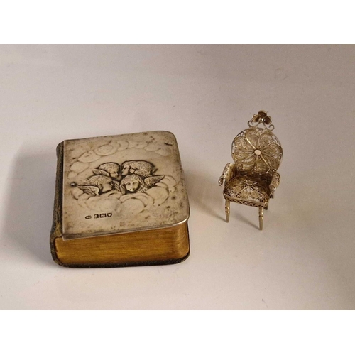 941 - Prayer book embossed with an angels head. London 1904 By W C and a miniature filigree chair.