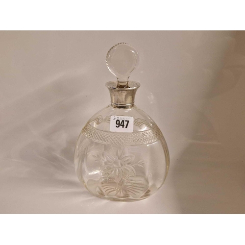 947 - Cut glass decanter and stopper with silver neck. 9.5 in high. Birmingham 1910