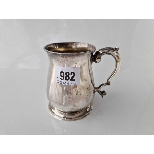 982 - George II half pint tankard with leaf capped handle and spreading foot. London 1746. Script JC?. 195... 