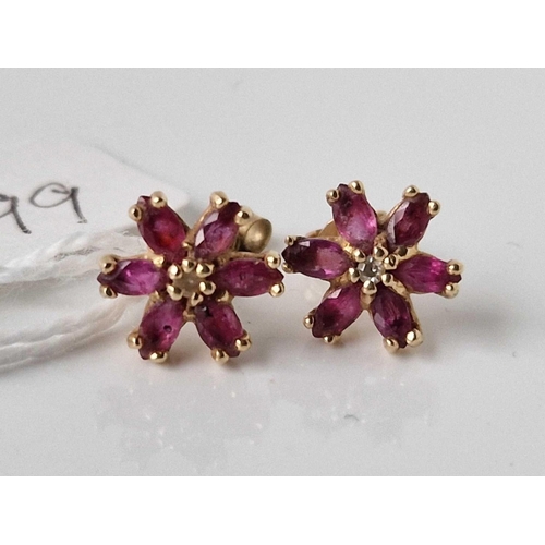 99 - A pair of ruby floral earrings 9ct 1.6 gms