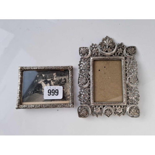 999 - A small 800 standard frame with pierced boarder & an Indian white metal frame, 5.5