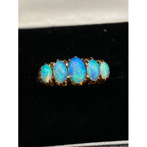 52 - A GOOD COLOUR FIVE STONE OPAL RING 18CT GOLD SIZE N 4.3 GMS