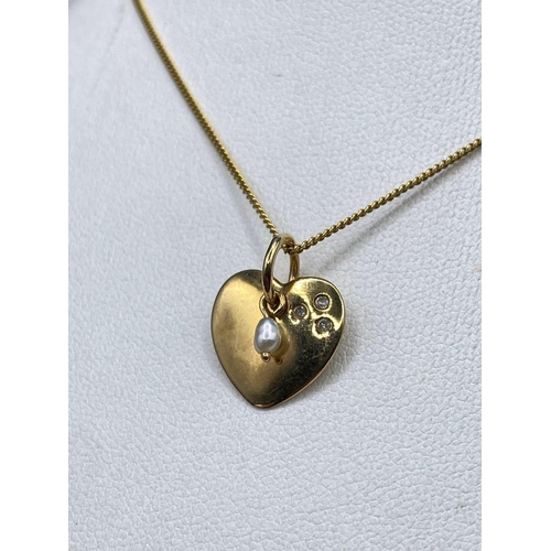 114 - A pretty heart pendant unique diamond and pearl in high carat with gold chain 16 inch