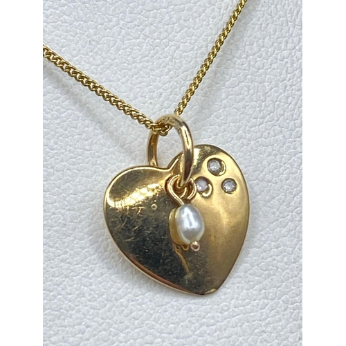 114 - A pretty heart pendant unique diamond and pearl in high carat with gold chain 16 inch