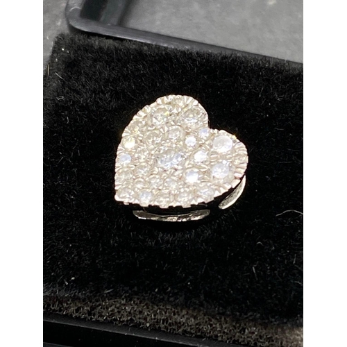 115 - A pretty diamond heart set with 0.30 of a carat full cut diamonds in high carat gold