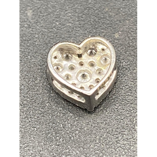 115 - A pretty diamond heart set with 0.30 of a carat full cut diamonds in high carat gold