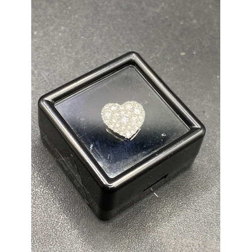 115 - A pretty diamond heart set with 0.30 of a carat full cut diamonds in high carat gold