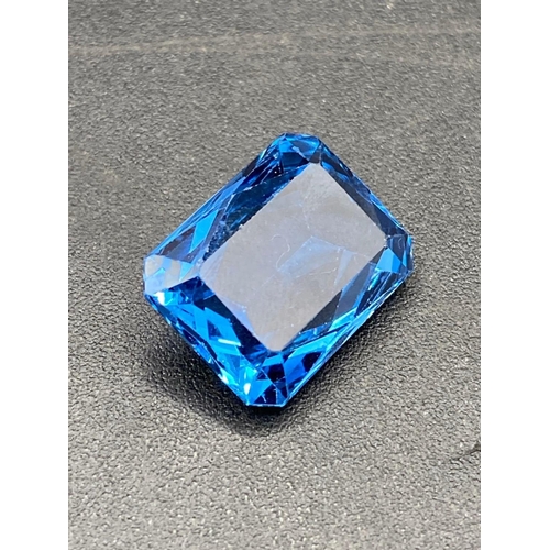 116 - A good deep blue Brazilian topaz special trapeze cut 22 carats