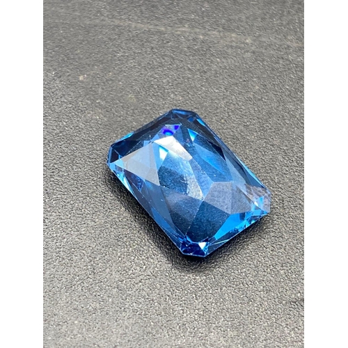 116 - A good deep blue Brazilian topaz special trapeze cut 22 carats