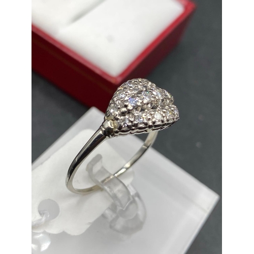 118 - A EARLY EDWARDIAN DIAMOND RING THE OVAL SHAPE WITH THREE ROWS OF BRILLIANT BRIGHT CUT DIAMONDS 18CT ... 