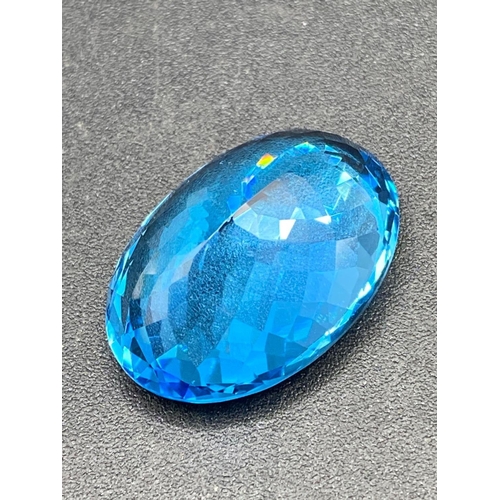 120 - A fine Brazilian intense blue topaz gem stone 29.5 X 20.6 X 13.6 65 carats