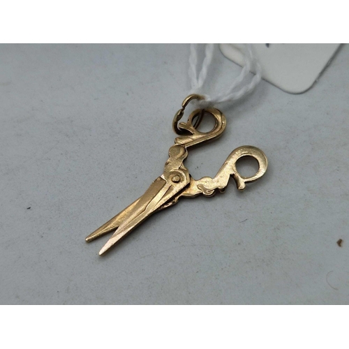 124 - A articulated gold scissors charm