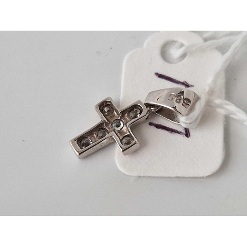 137 - A white gold and diamond cross pendant, 14ct, 1 g