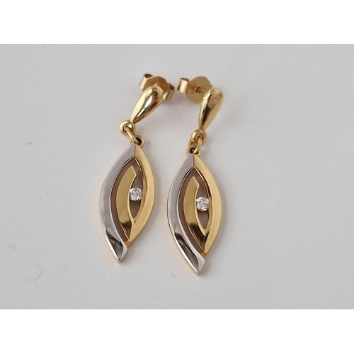 190 - A pair of two colour gold and diamond earrings, 18ct, 3.1 g.