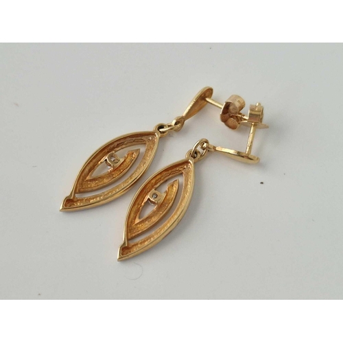 190 - A pair of two colour gold and diamond earrings, 18ct, 3.1 g.