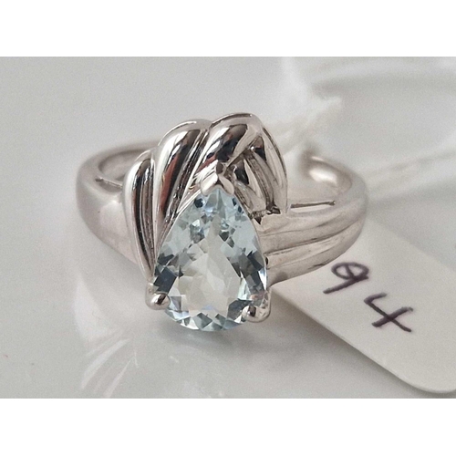 194 - A white gold topaz stylized ring, size N, 2.5 g.