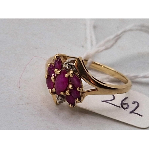 262 - A nine stone ruby and diamond ring, size R, 2.5 g.