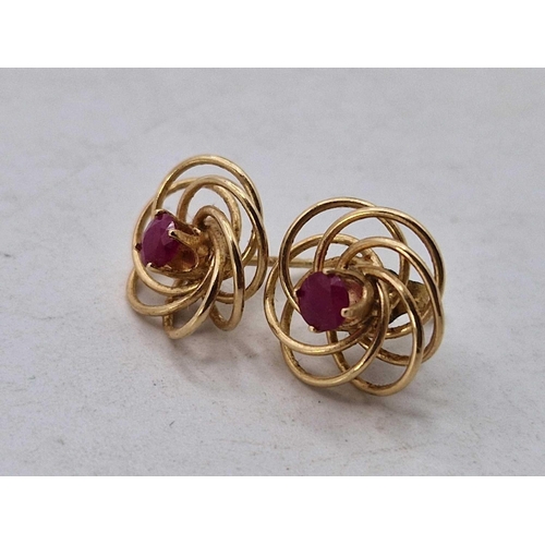 263 - A pair of ruby and gold swirl earrings, 14ct, 1.3 g.