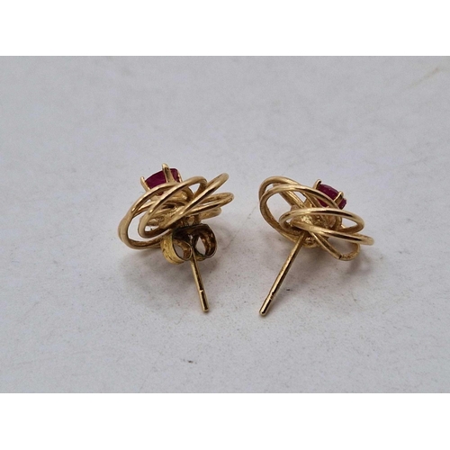 263 - A pair of ruby and gold swirl earrings, 14ct, 1.3 g.