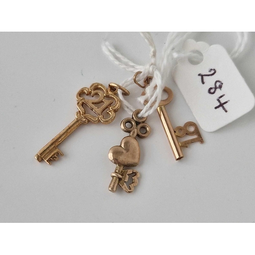 284 - Three key charms, 9ct, 3.4 g.