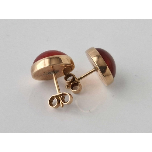 289 - A pair of gold mounted carnelian earrings, 4.9 g.