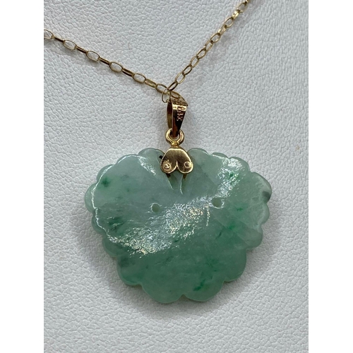 297 - A jade and gold carved butterfly pendant 14ct gold with gold chain 18 inch