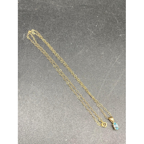 313 - A pretty aquamarine drop pendant on gold chain 18 inch