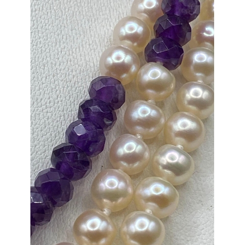 317 - A fantabulous pearl and amethyst opera length faceted necklace 46 inch