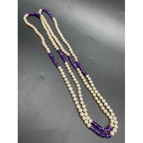 317 - A fantabulous pearl and amethyst opera length faceted necklace 46 inch