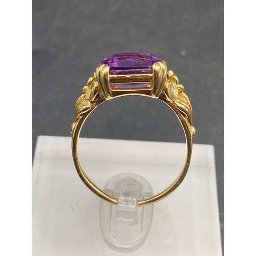 331 - A large emerald cut amethyst ring on heavy fancy mount 9ct size R 6.5 gms