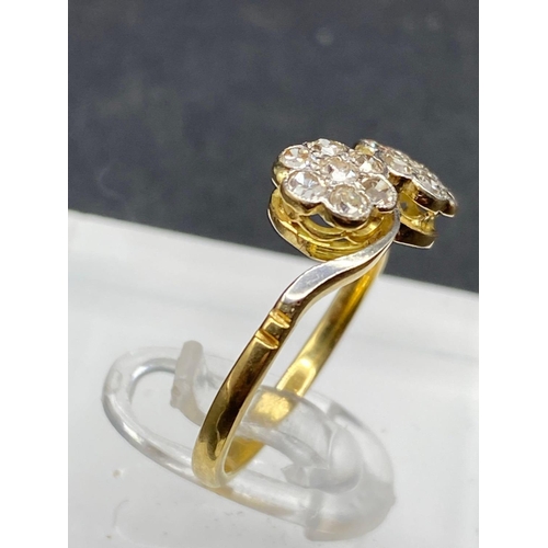 335 - A twist diamond cluster ring set in gold size M 2.6 gms