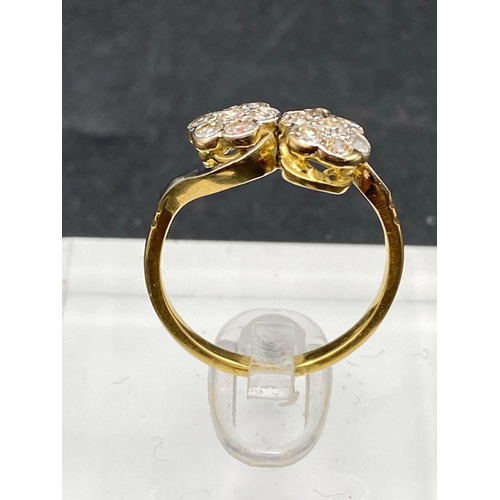 335 - A twist diamond cluster ring set in gold size M 2.6 gms