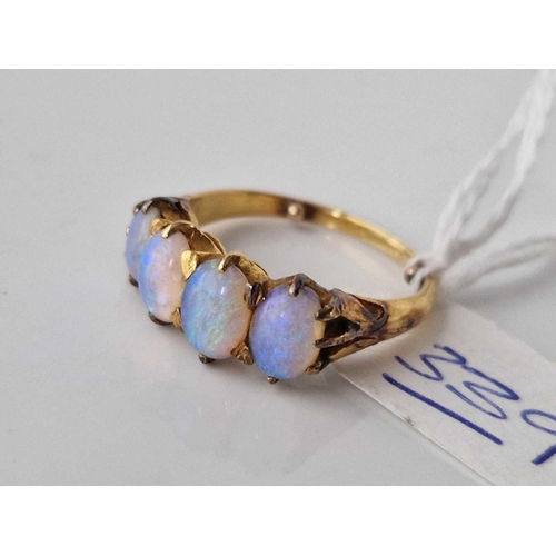 339 - A four stone opal ring set in high carat gold size N 5.4 gms