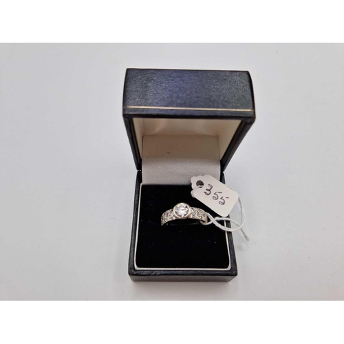 355 - A white gold CZ ring, 9ct, 5.3 g. boxed