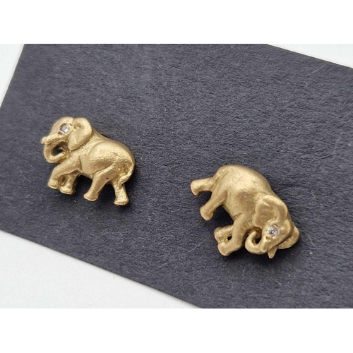 356 - A pair of elephant earrings with diamond eyes, 9ct